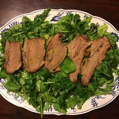 California Farm Crusted Lamb on Arugula A picture of California Farm Crusted Lamb on Arugula.