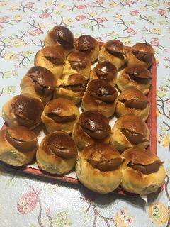 Una foto de Miguelitos o pan de leche relleno