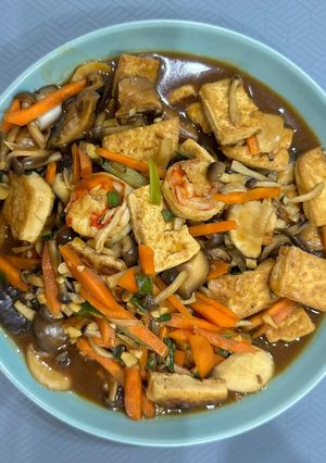 A picture of Tofu with mix mushroom pot.