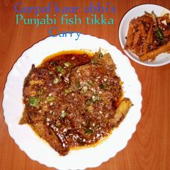 A picture of Punjabi fish tikka curry🐠🍅🧅🌶️🌿.