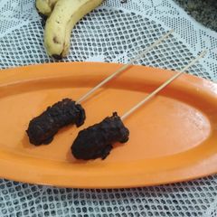 A picture of Chocolate coated banana pops.
