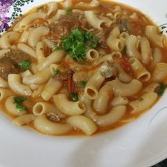 A picture of Pasta in meat and tomato sauce.