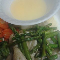 A picture of Swai and asparagus.