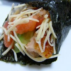 A picture of Unique Hand Rolls Avocado and Chicken with Salsa.