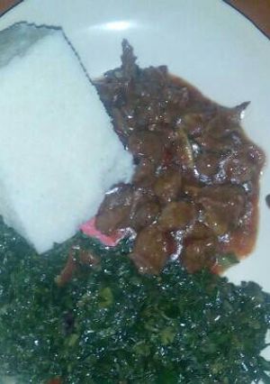 A picture of Ugali,Sukuma with spinach and beef.