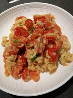 A picture of Scrambled Eggs w/ Tomato.