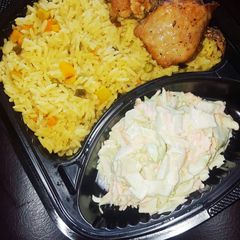 A picture of Fried rice,coleslaw and chicken.