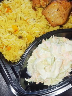 A picture of Fried rice,coleslaw and chicken.