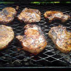 A picture of grilled pork chops with guava glaze.