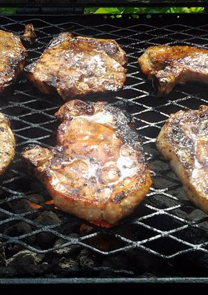 A picture of grilled pork chops with guava glaze.