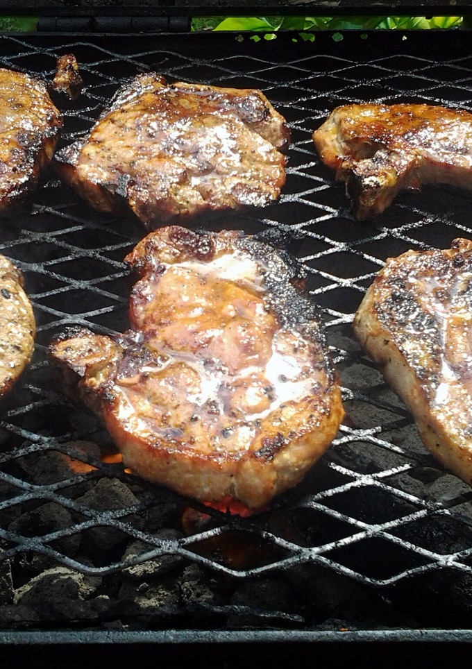 A picture of grilled pork chops with guava glaze.