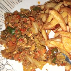 A picture of Chips with egg n veggies sauce.