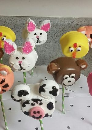 A picture of Chocolate dipped marshmallow animals pops.