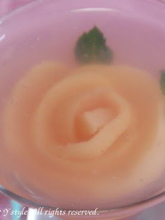 A picture of Rose Jello with Peach Compote.