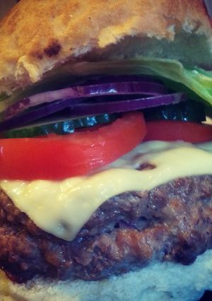 A picture of Weezy's delicious cheese stuffed cheeseburgers!.