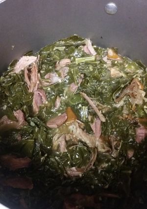 A picture of Collard Greens with Smoked Turkey Leg.