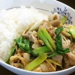 A picture of Garlic Scapes and Pork Belly Fried in Oyster Sauce.