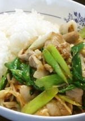 A picture of Garlic Scapes and Pork Belly Fried in Oyster Sauce.