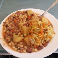 A picture of Githeri with Potato and Cabbage salad.