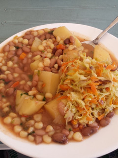 A picture of Githeri with Potato and Cabbage salad.