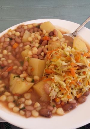 A picture of Githeri with Potato and Cabbage salad.