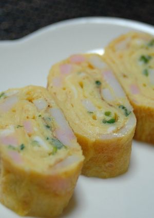 A picture of Rolled Omelette with Kamaboko Fish Cakes and Green Onions for Lunchboxes.