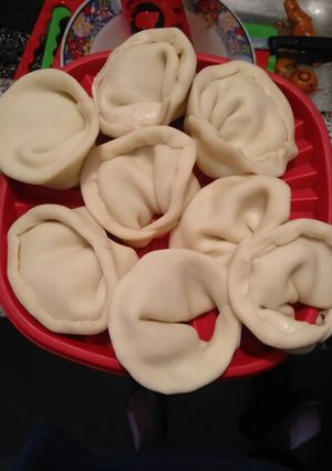 Una foto de Agnolotis con tapa de empanada