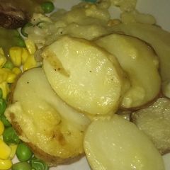 A picture of Yummy scrummy garlicky potato bake.