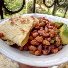 Coconut cumin beans with Naan bread A picture of Coconut cumin beans with Naan bread.