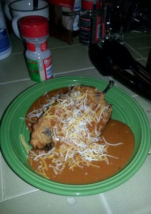A picture of Yummy Poblano Peppers aka Chili Rillenos with Homemade enchilada sauce! :-).