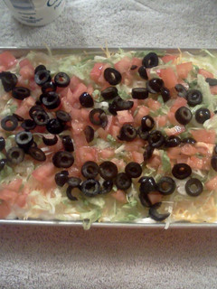 A picture of nivi's 8 layer taco dip.