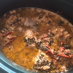 A picture of CROCKPOT TUSCAN GARLIC CHICKEN WITH SPINACH AND SUN-DRIED TOMATOES.