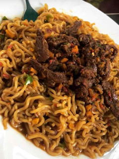 A picture of Indomie with beef sauce.