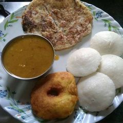 A picture of Idli, Sambhar, Vada, Uttapam.