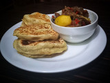 Flat bread with goat meat pepper soup