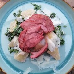 A picture of Smoked duck with kale, pomelo and walnut dressing.
