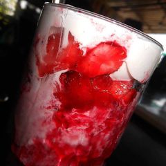 A picture of Strawberry Milk Shake topped with Vanilla Ice-Cream.