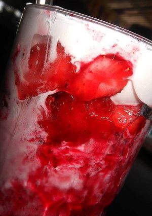 A picture of Strawberry Milk Shake topped with Vanilla Ice-Cream.