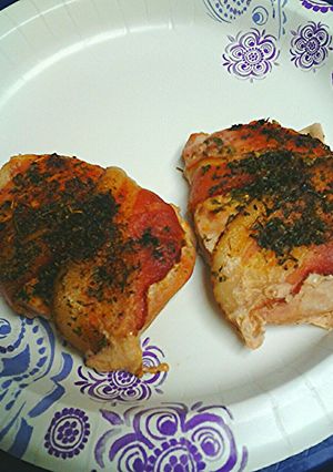 A picture of Herb/spice stuffed and encrusted bacon wrapped pork loin.