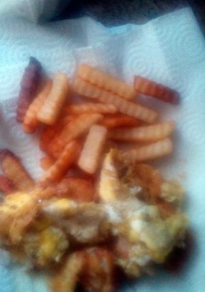 A picture of Breaded Fish fillet covered with Egg.