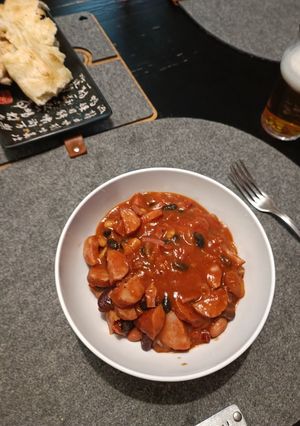 A picture of Baked Beans with Smoked Sausages.