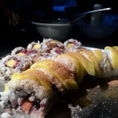 A picture of Mango sticky rice sushi.