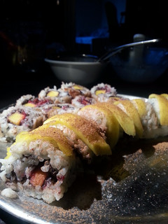 A picture of Mango sticky rice sushi.