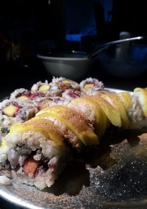 A picture of Mango sticky rice sushi.