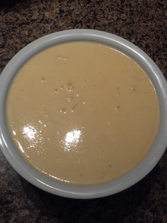A picture of Cheddar cheese sauce.