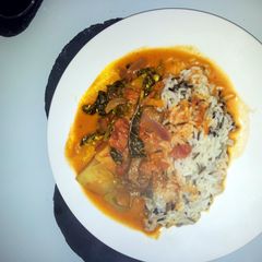 A picture of spicy tomato creamy lamb curry.
