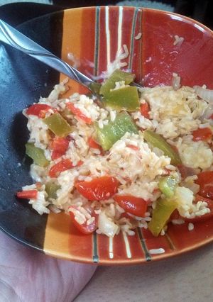 A picture of cheese rice with vegtables.