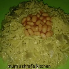 A picture of Indomie with baked beans.