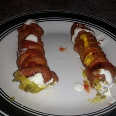 A picture of Fried zombie mummy dogs.