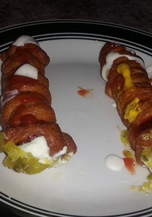 A picture of Fried zombie mummy dogs.